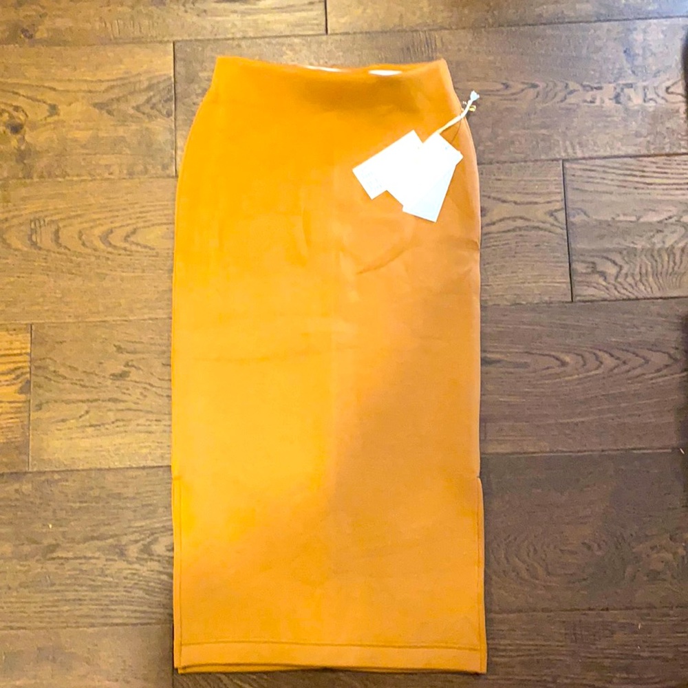 Leze the Label skirt in camel. Size small but fits tight.